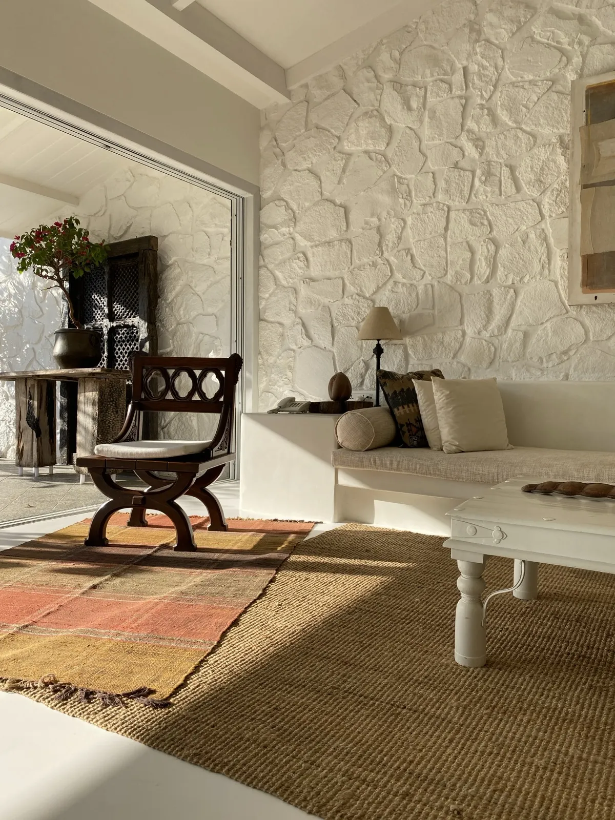White stone wall and jute seating at the Beach House by Sonia Gehlot