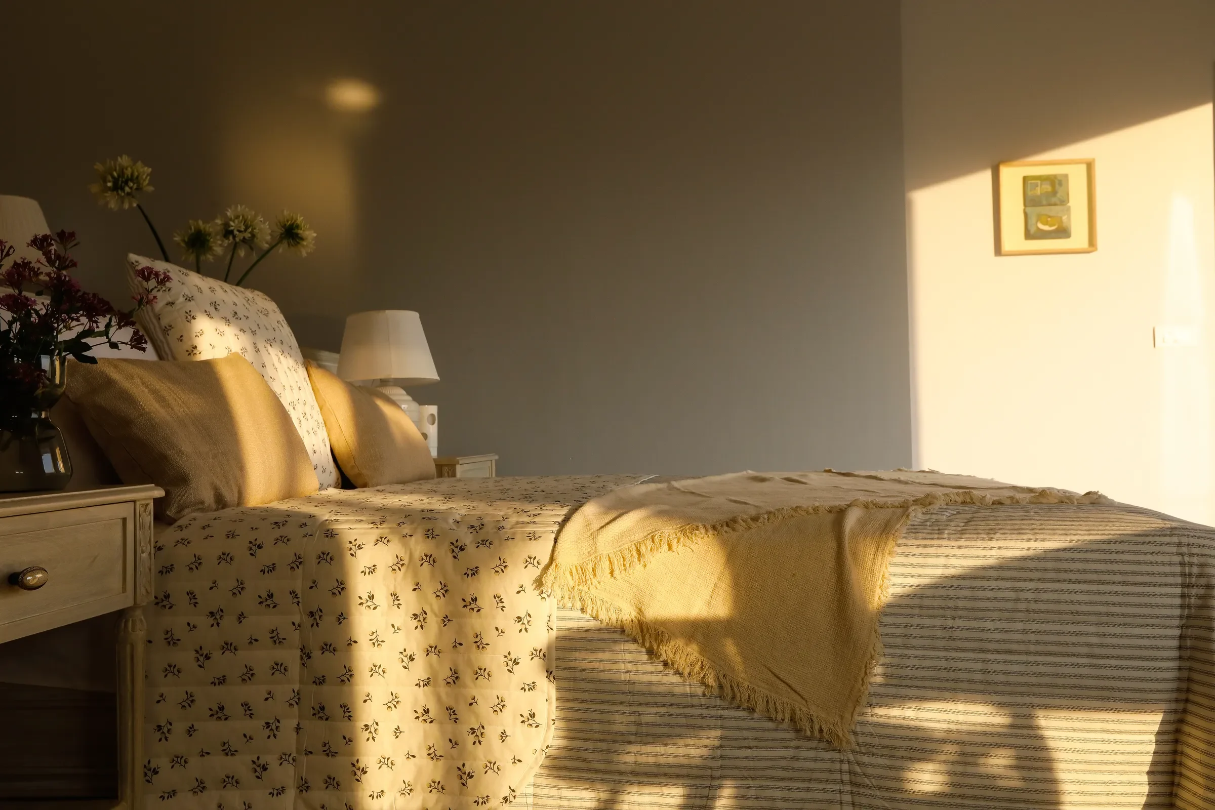 A bed in late afternoon light at the Coonoor bungalow