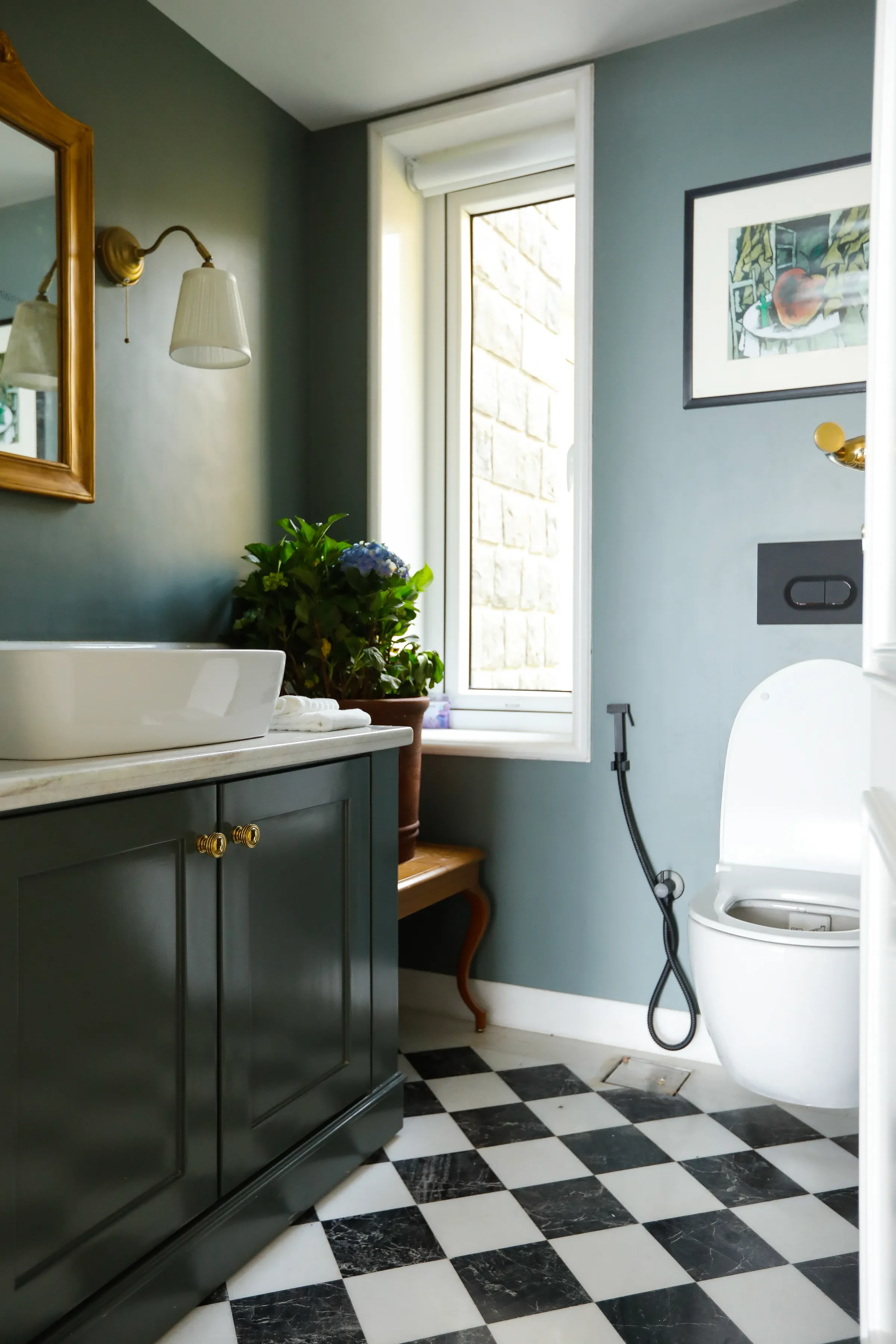 The powder room with a checkerboard floor