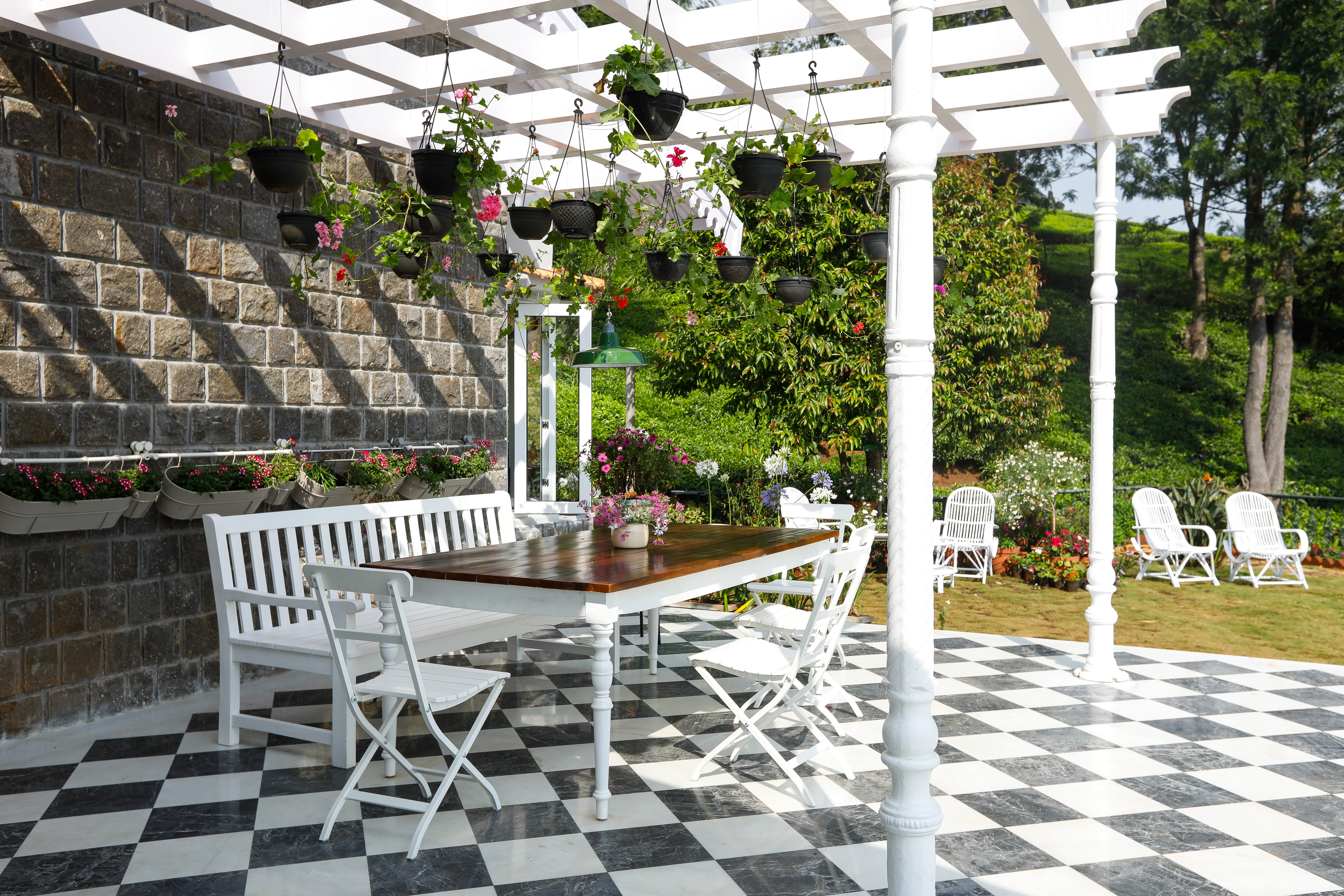 An arched doorway and planted courtyard at the Coonoor bungalow