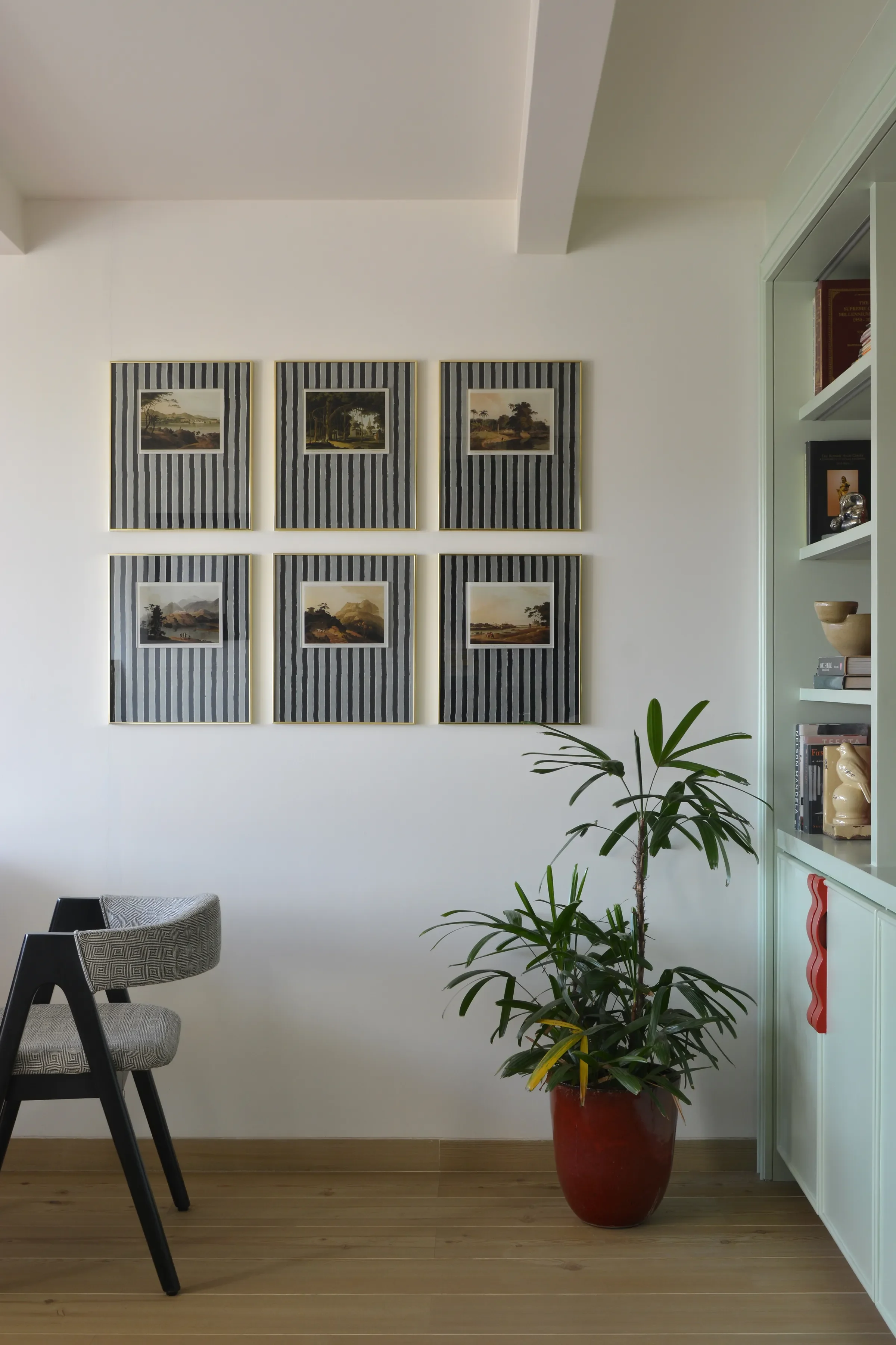 Framed prints and a plant at the Kala Ghoda chambers