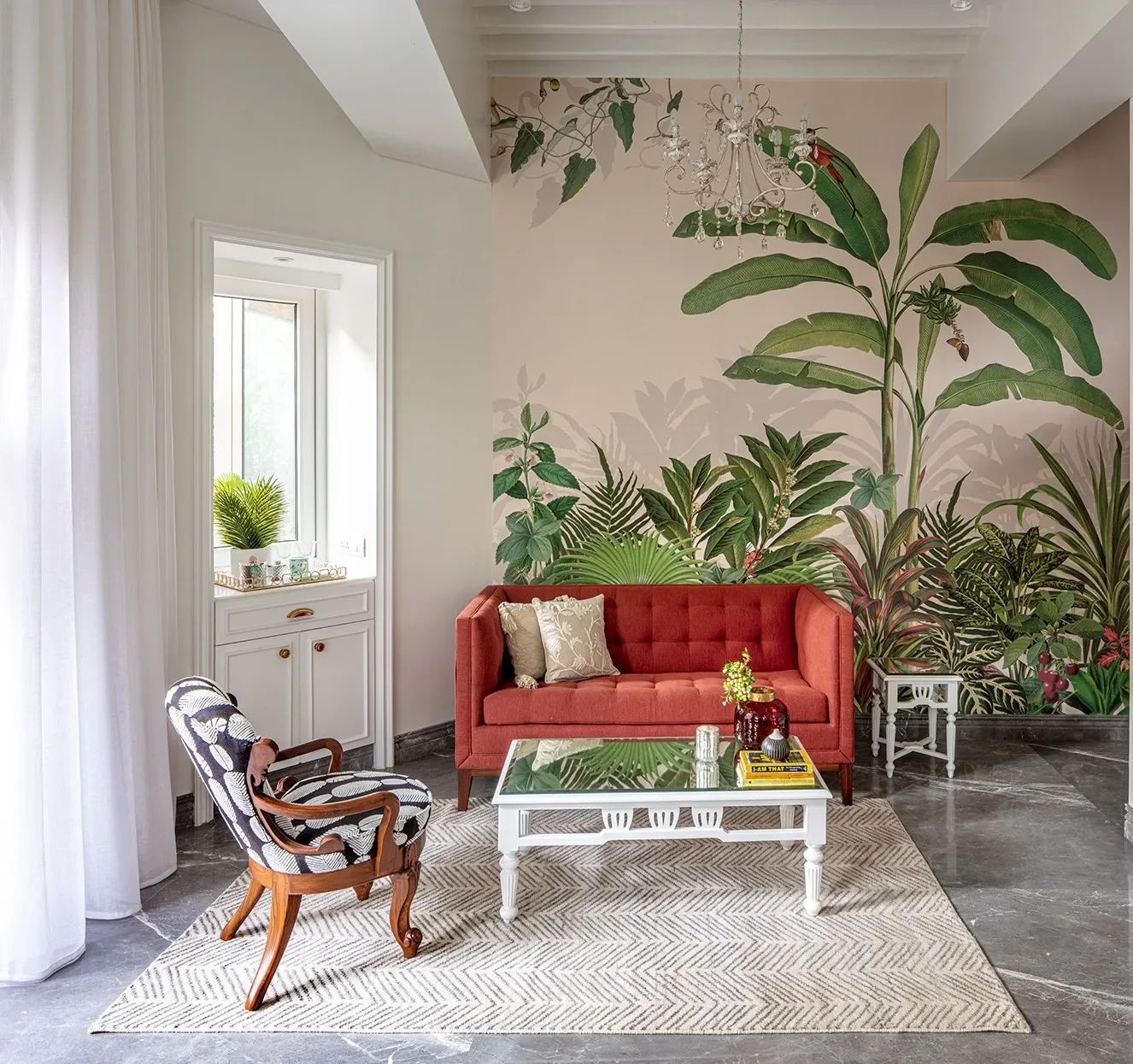 The red sofa against the painted garden mural at The Healing Centre