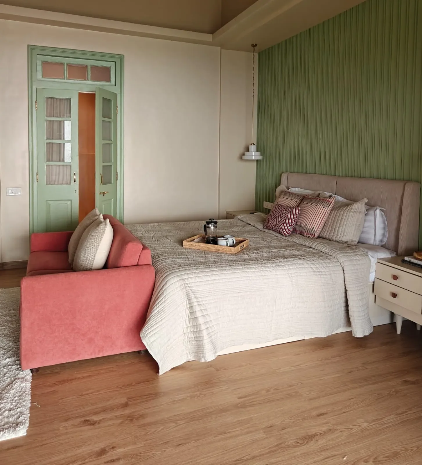 The green fluted bedroom and its coral daybed at Tranquila