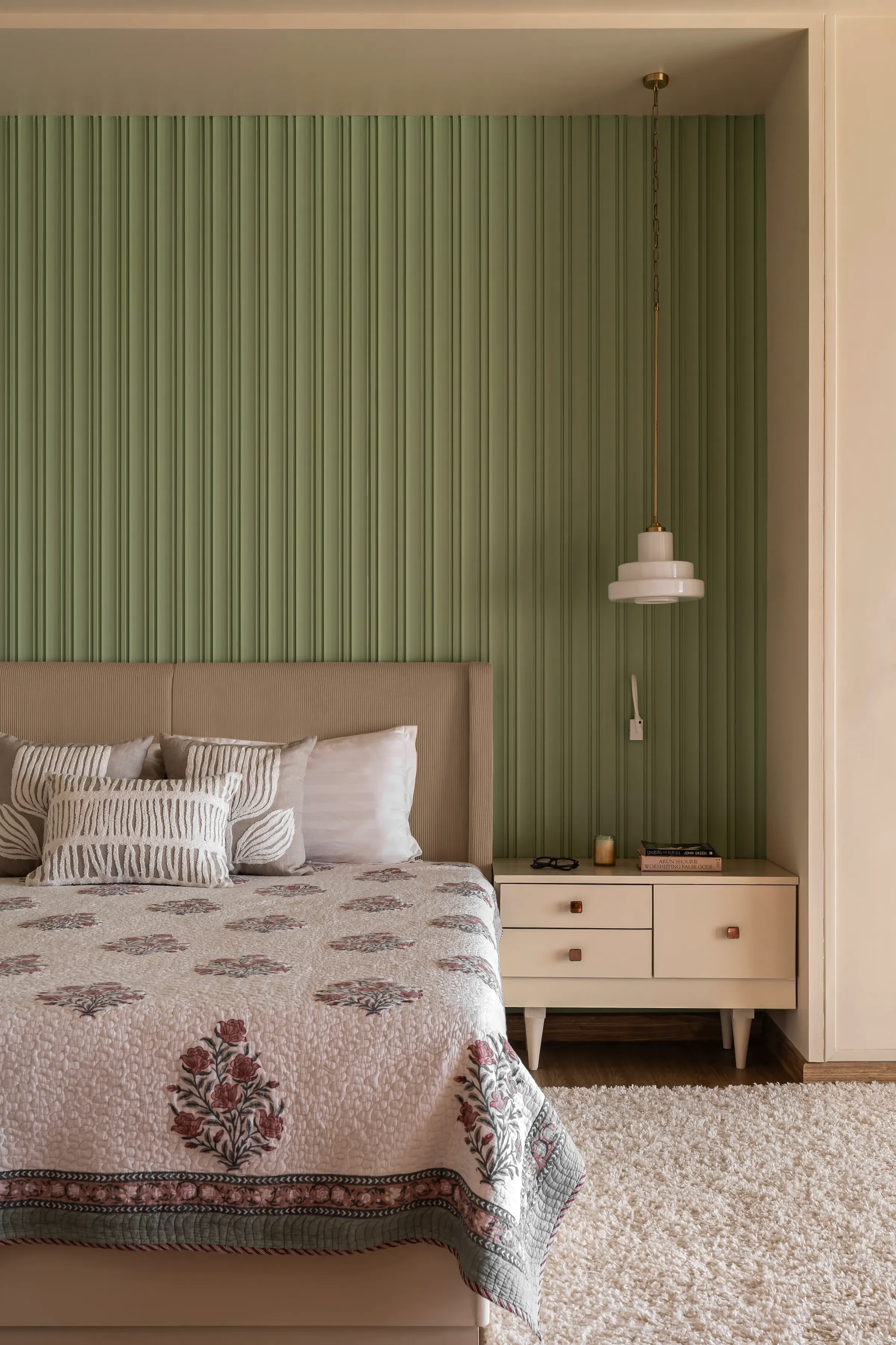 The sage green bedroom at Tranquila