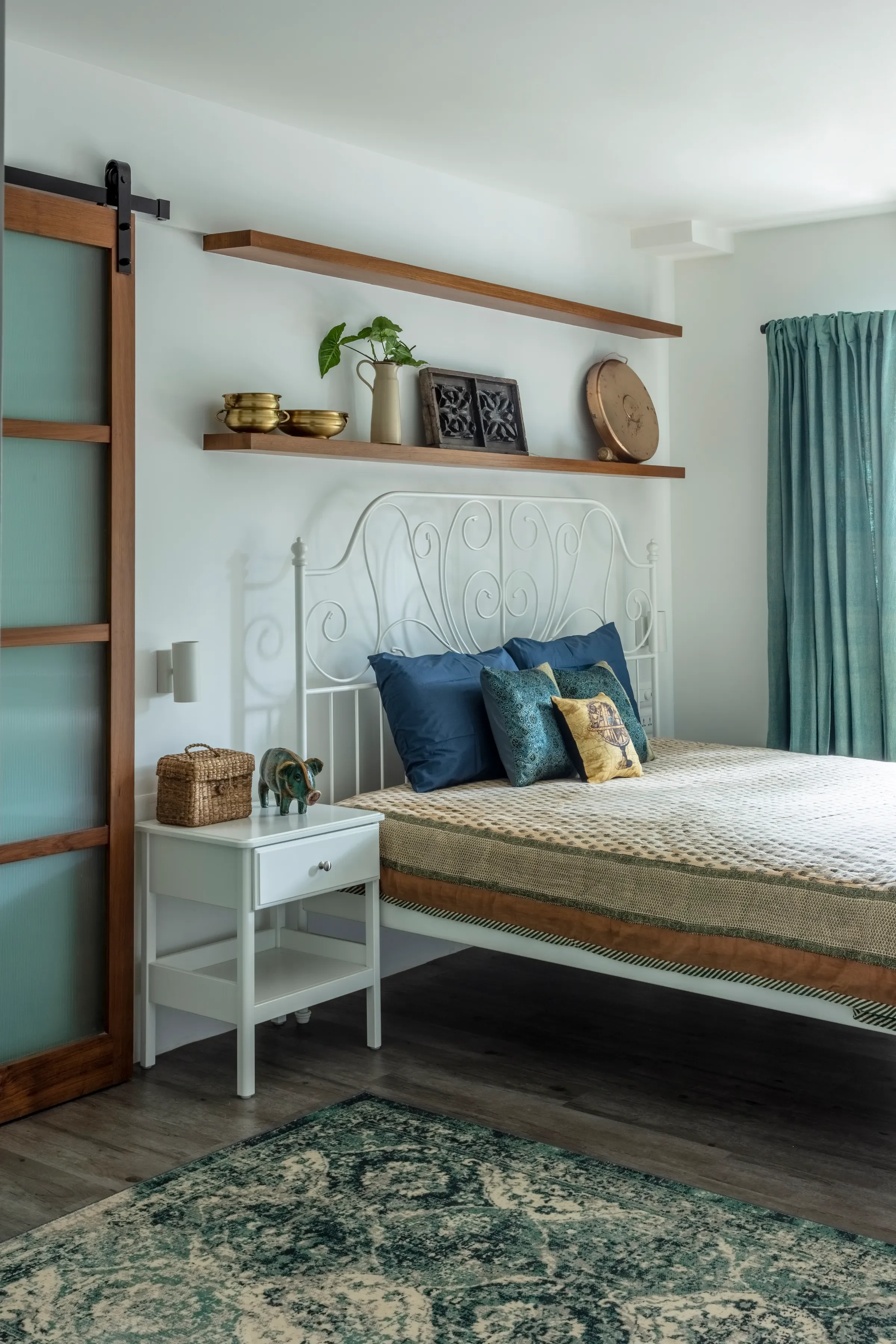 A bedroom behind the sliding barn door at The Deep Dive