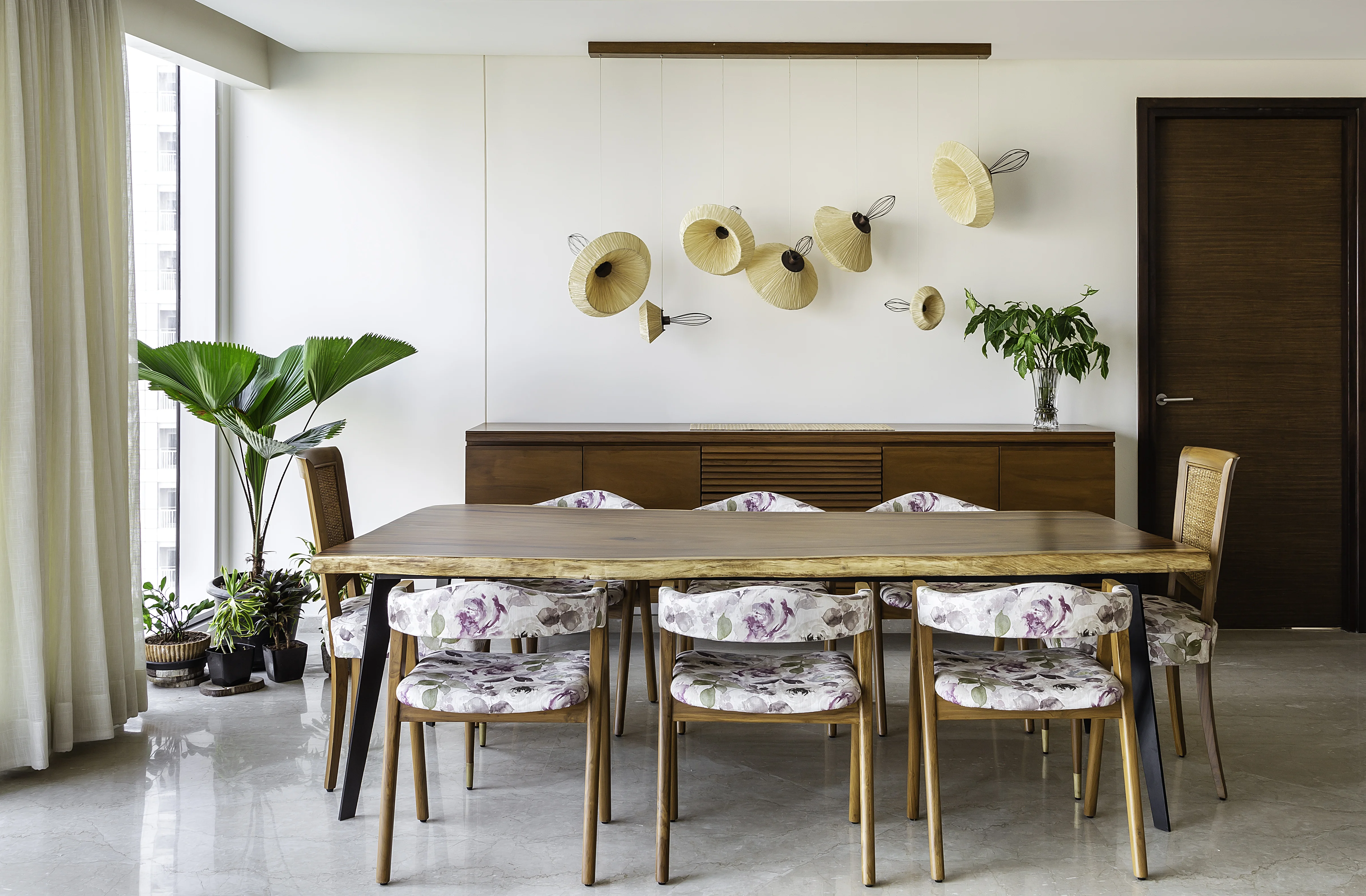 The master bedroom with dusty pink upholstery at the mid-century apartment