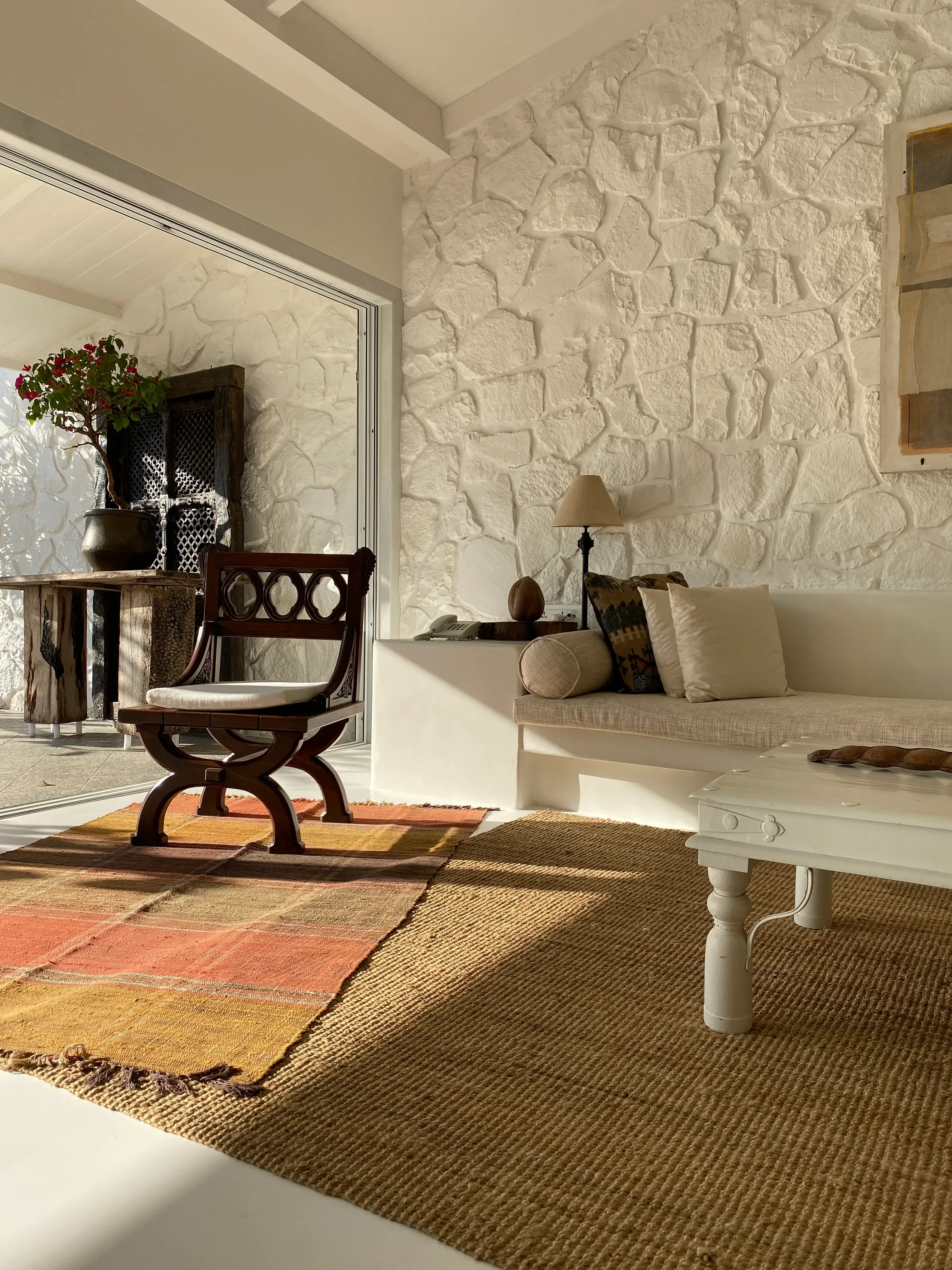 A carved chair beside the stair at the Marve beach house