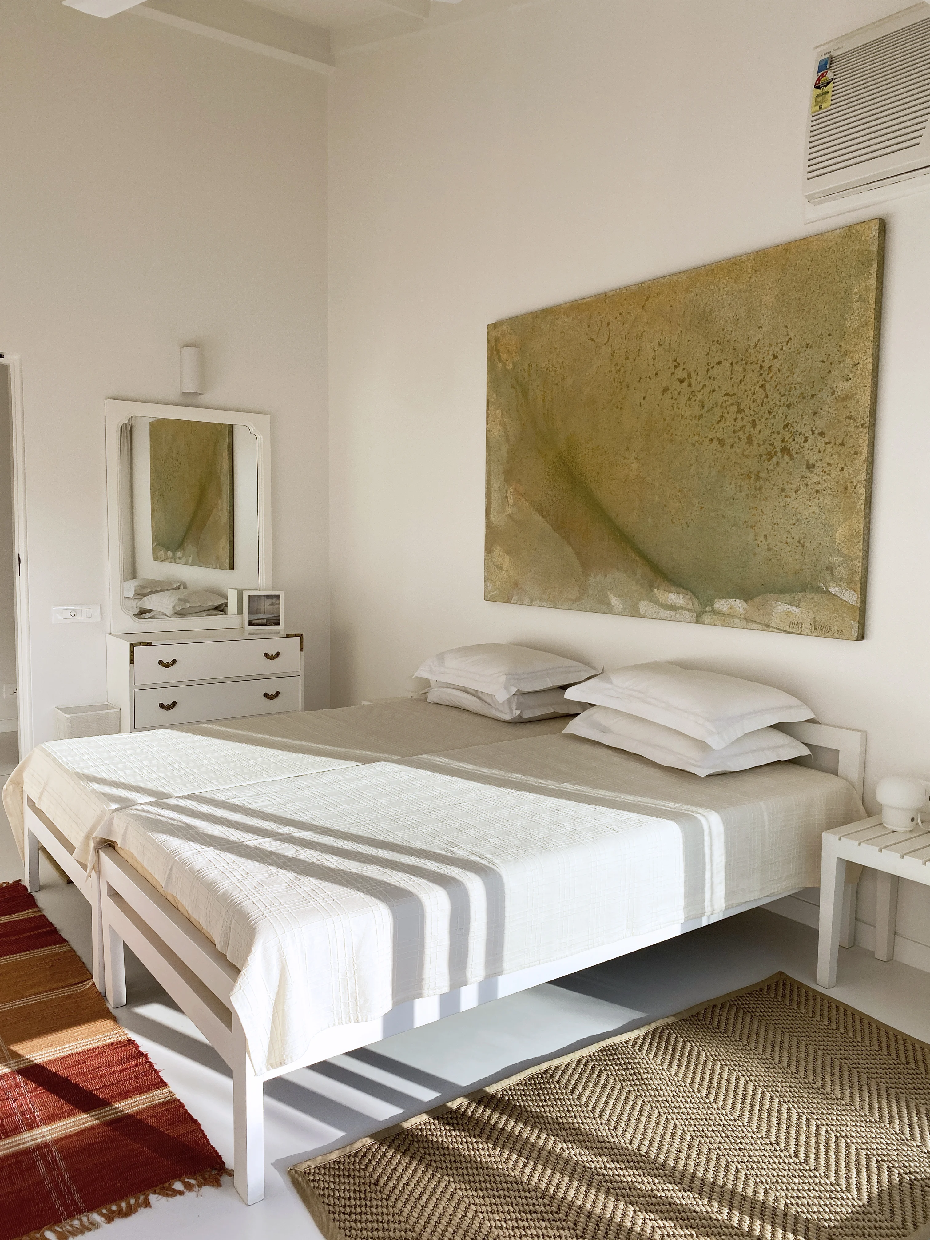 A stone-walled bathroom at the Marve beach house