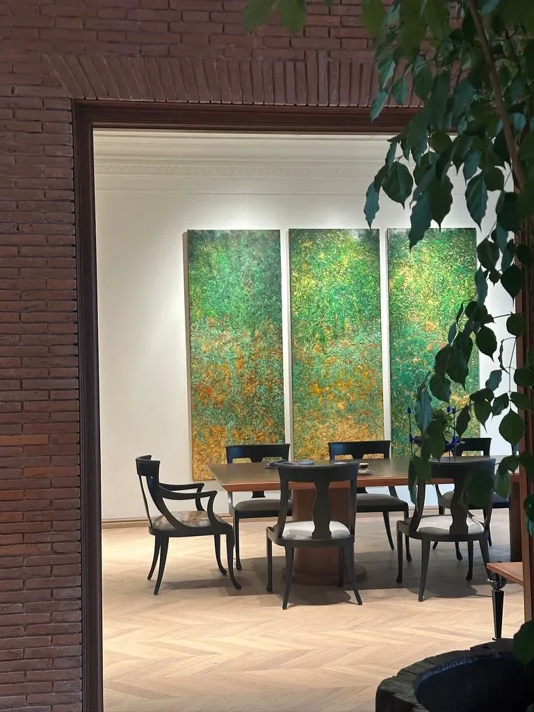 The dining room behind a green painted screen at the Delhi farmhouse
