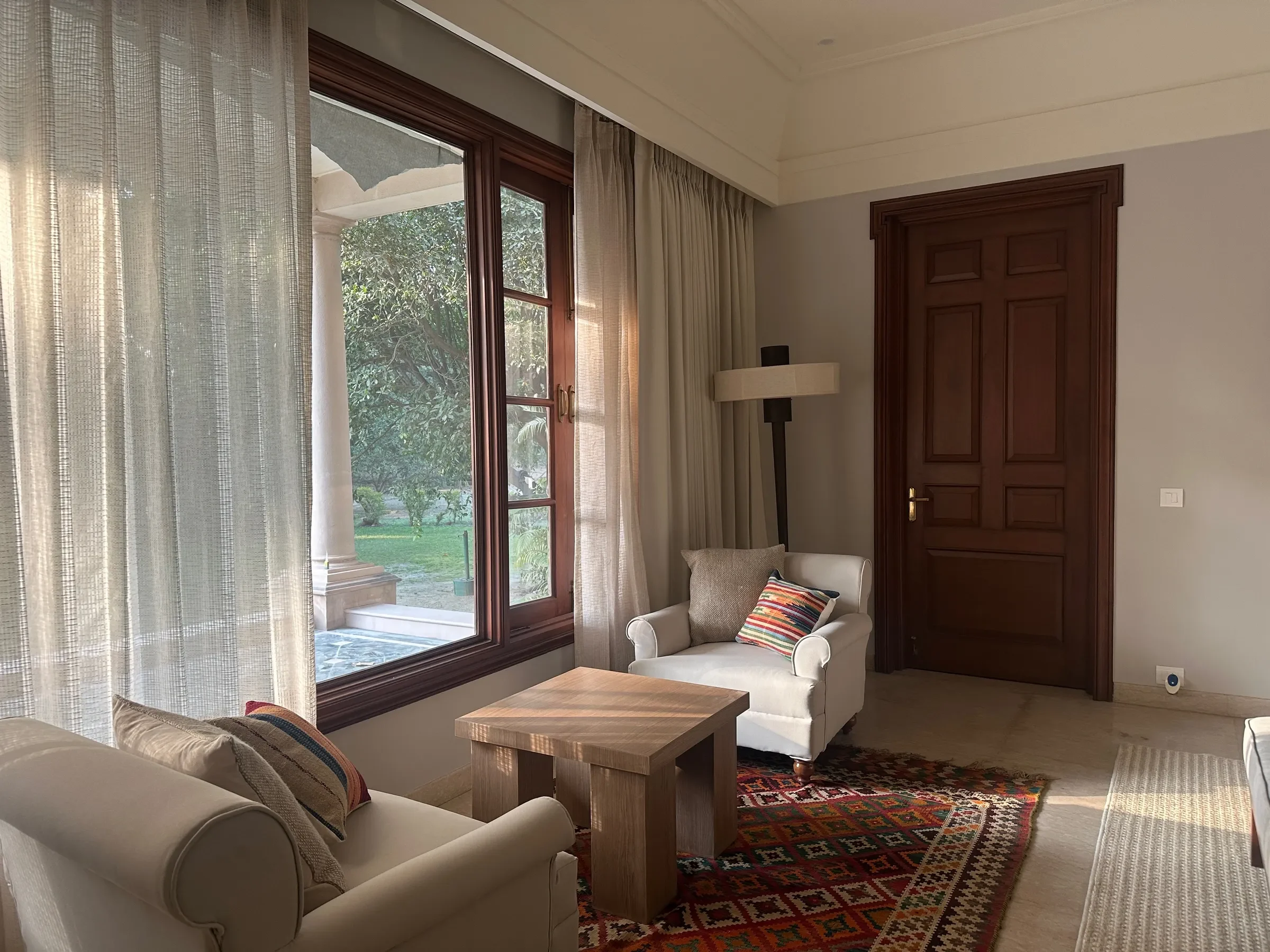 Window seating with a kilim at the Delhi farmhouse