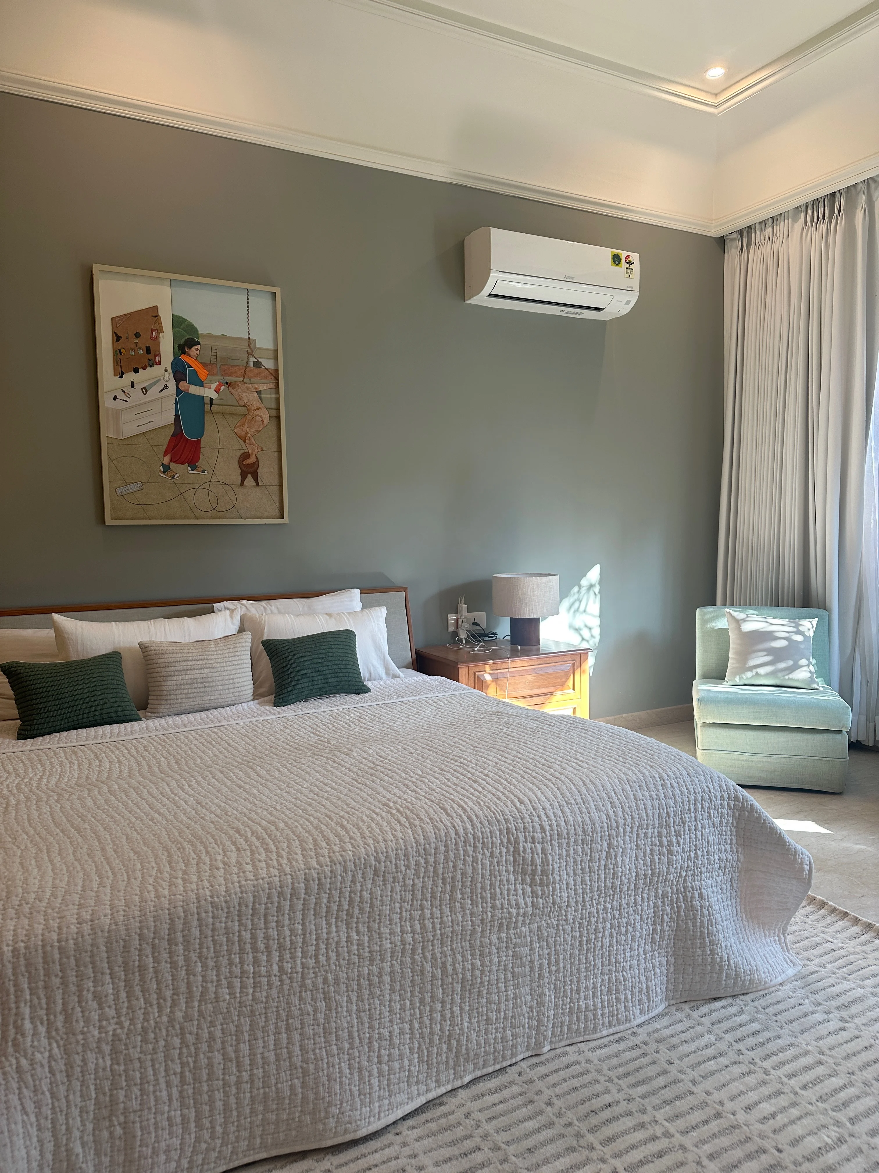 A dressing area with a wooden wardrobe at the Delhi farmhouse