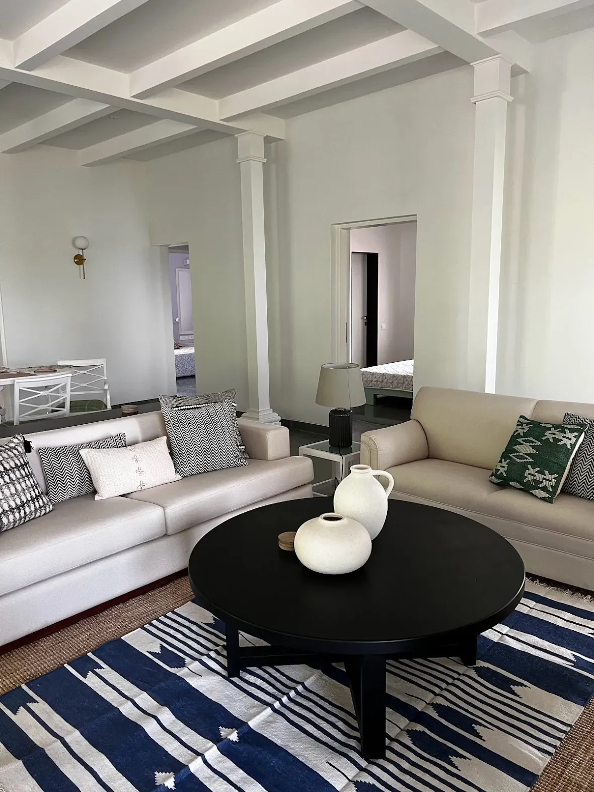 The living room and its indigo dhurrie at the Malkhed house