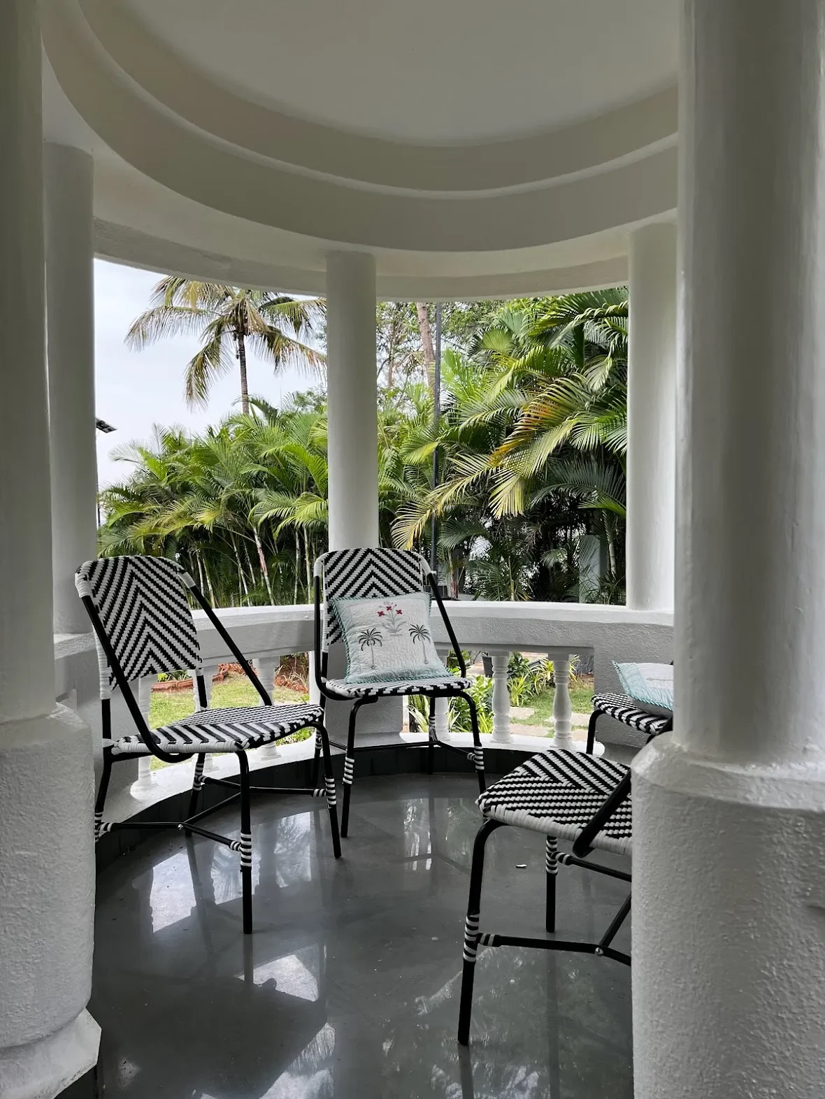 Striped loungers between the columns at the Malkhed house