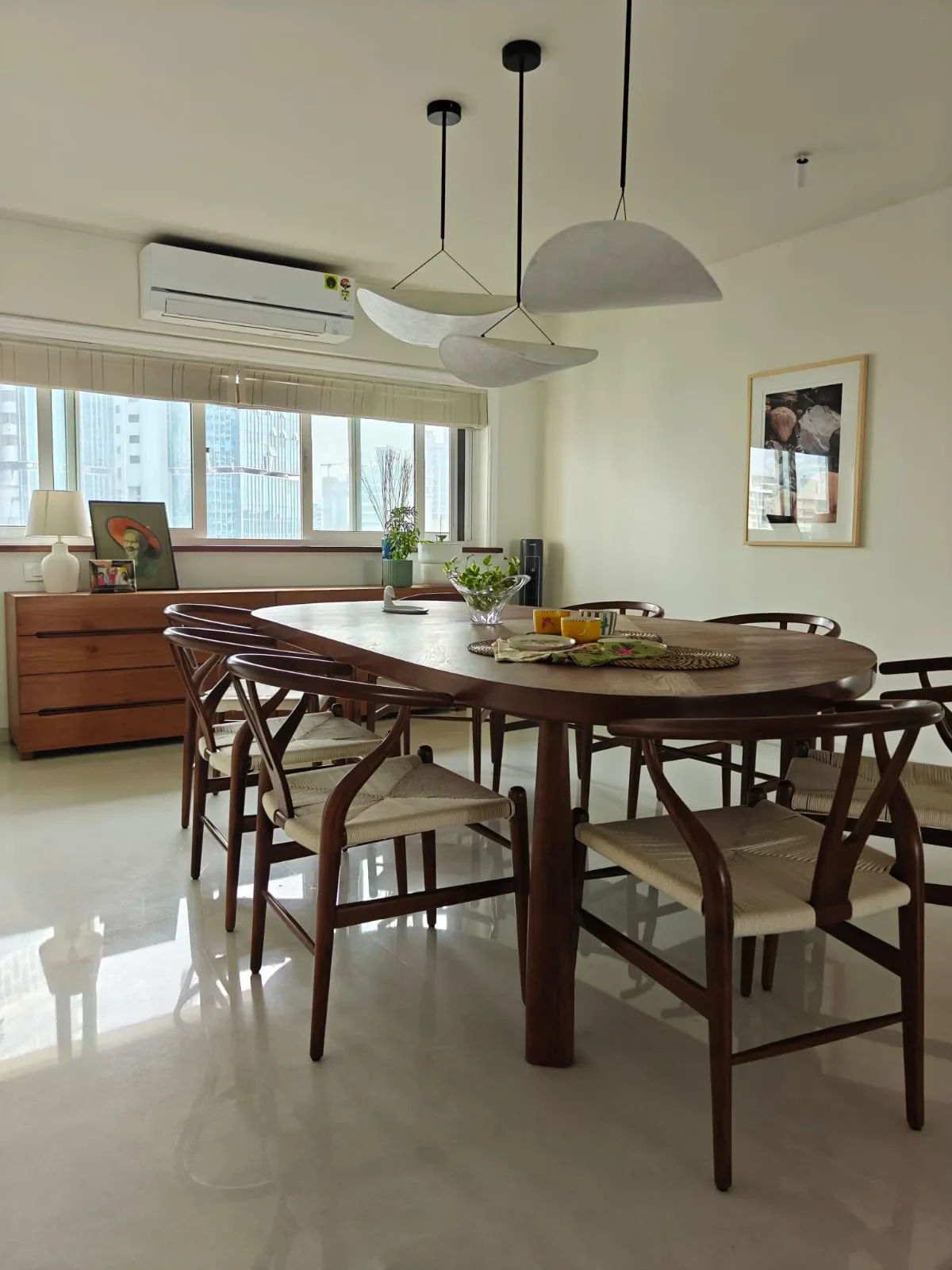 The dining table and wishbone chairs at the Sterling apartment