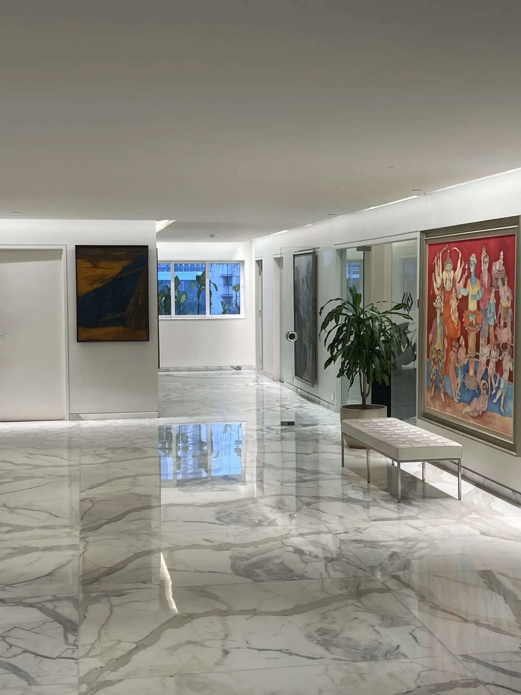 The marble corridor with large paintings at the RPG office
