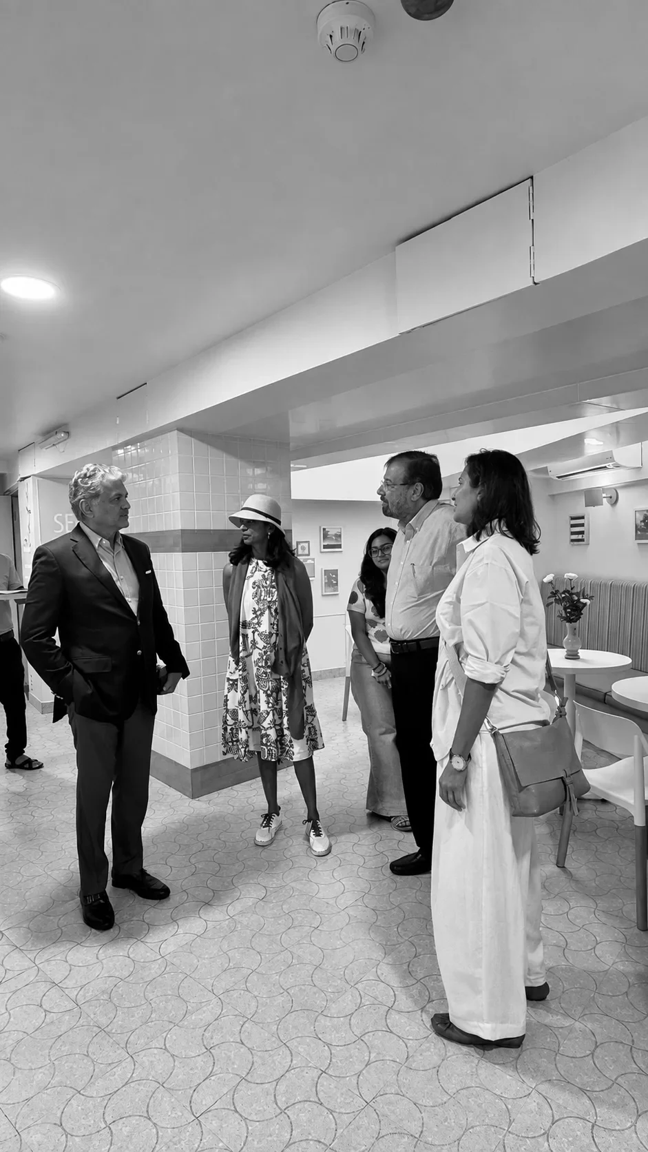 A site visit at the café, the team reviewing the space