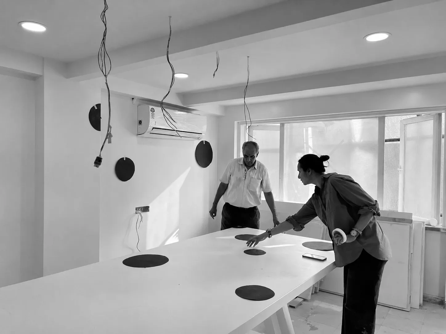 Marking out table settings against the wall discs on site